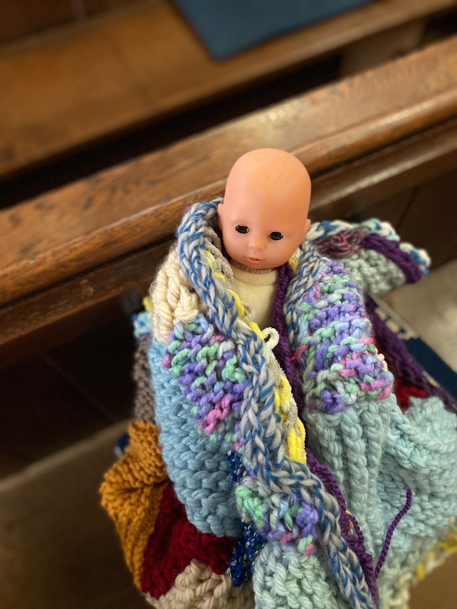 Baby Jesus in knitted blanket